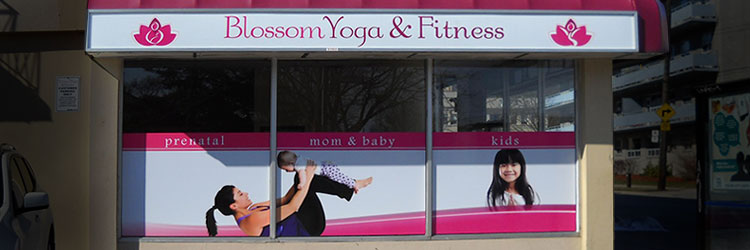 Full colour window graphics with photographs of healthy people practising yoga